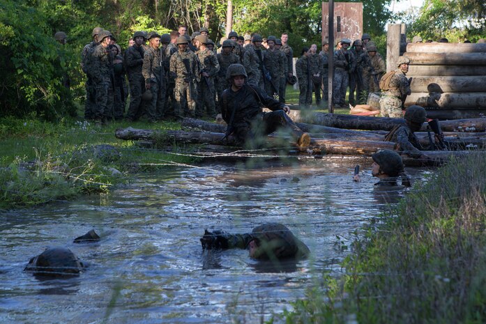 U.S. Marines and Sailors with Combat Logistics Regiment 2, 2nd Marine Logistics Group (2nd MLG) run through an endurance course during an annual squad competition at Camp Lejeune, North Carolina, May 15, 2019. The Marines and Sailors participated in the 2nd MLG annual squad competition to test their combat skills and to maintain operational readiness.
