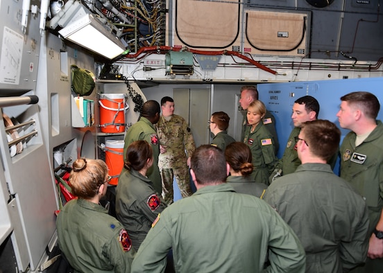 Staff Sgt. Carl Kocon, loadmaster with the 758th Airlift Squadron, teaches Airmen from the 914th Aeromedical Evacuation Squadron proper evacuation procedures at Barbers Point Airfield, Hawaii April 24, 2019. This was part of dissimilar aircraft training for the 914th AES Airmen as they usually work with KC-135 Stratotankers. (U.S. Air Force photo by Senior Airman Grace Thomson)