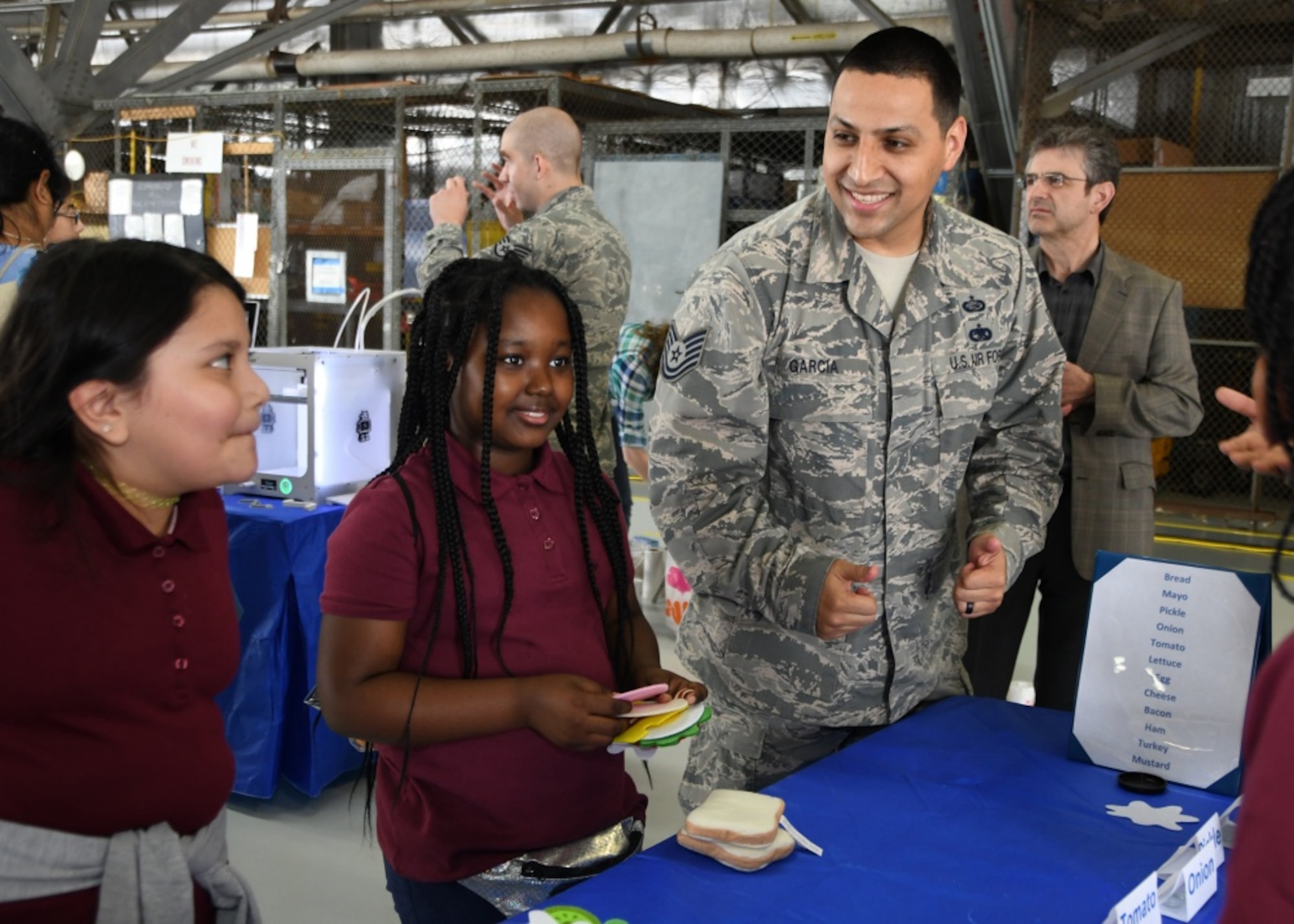 Participants in the Legends in Flight Joint Base Andrews  Air and Space Expo 2019 look at various set-ups in the Science Technology Engineering and Math hangar on JB Andrews, Md.,  May 10, 2019. More than 7,000 local students came out to the STEM hangars. (U.S. Air Force photo by Staff Sgt. Cierra Presentado)