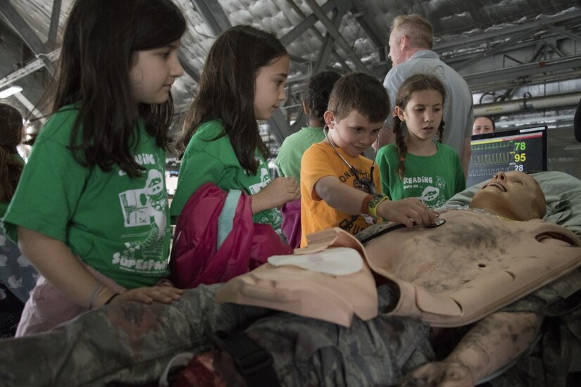 Participants in the Legends in Flight Joint Base Andrews  Air and Space Expo 2019 look at various set-ups in the Science Technology Engineering and Math hangar on JB Andrews, Md., May 10, 2019. More than 7,000 local students came out to participate in various activities in the STEM hangars. (U.S Air Force photo by Senior Airman Andreaa Phillips)