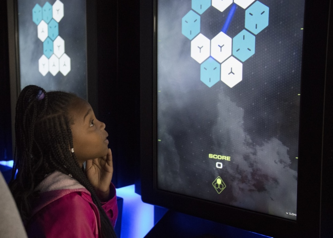 Participants in the Legends in Flight Joint Base Andrews  Air and Space Expo 2019 look at various set-ups in the Science Technology Engineering and Math hangar on JB Andrews, Md.,  May 10, 2019. More than 7,000 local students came out to participate in various activities in the STEM hangars. (U.S Air Force photo by Senior Airman Andreaa Phillips)