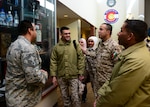 U.S. Air Force Senior Master Sgt. Jose Alfaro, 140th Wing Security Forces, Colorado Air National Guard, escorts members of the Royal Jordanian Air Force on a tour of the Chief Warrant Officer 5 Dave Carter Army Aviation Support Facility at Buckley Air Force Base, Aurora, Colorado, Feb. 5, 2019. The meeting between Jordanians and senior enlisted leaders aimed to foster strong relationships between forces as well as enhance Jordanian enlisted policy and practices.  Jordan and Colorado have been partners since 2004. (U.S. Air National Guard Photo by Staff Sgt. Austin Harvill)