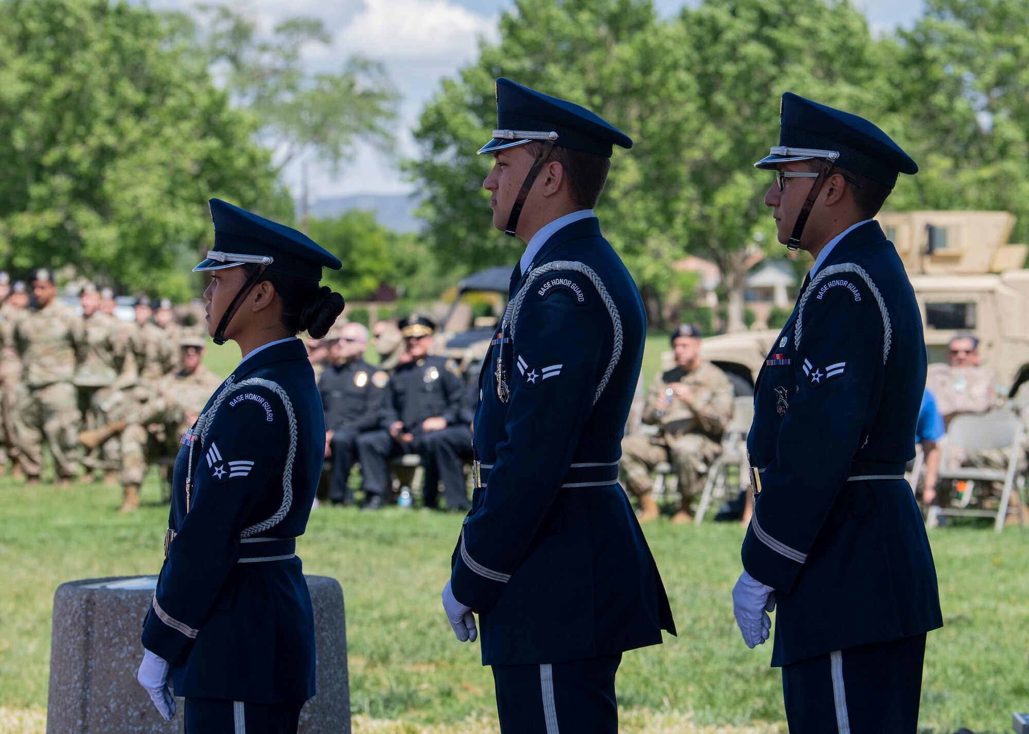 Kirtland Air Force Base Honor Guardsmen stand before lowering the flag during the Police Week Memorial Retreat Ceremony at Kirtland Air Force Base, N.M., May 15. National Police Week is an annual nationwide tribute to law enforcement officers who have lost their lives in the line of duty for the safety and protection of others. National Police Week started Sunday, May 12, and ends Saturday, May 18. (U.S. Air Force photo by Staff Sgt. J.D. Strong II)