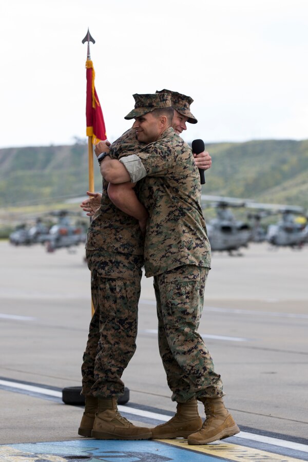 U.S. Marine Corps Lt. Col. Jeffrey Robb, commanding officer, Marine Light Attack Helicopter Squadron (HMLA) 369, congratulates Sgt. Maj. Carey R. Wells, oncoming sergeant major of HMLA-369, during a relief and appointment ceremony for HMLA-369 on Marine Corps Air Station Camp Pendleton, Calif., May 10, 2019. The ceremony formally recognized Sgt. Maj. Michael R. Buckles for his honorable service and dedication to the Corps and welcomed Wells as HMLA-369’s new sergeant major. (U.S. Marine Corps photo by Lance Cpl. Levi J. Guerra)