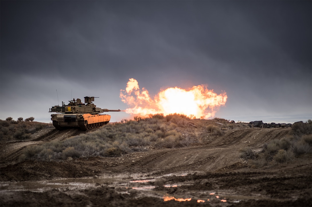 A tank fires its gun.