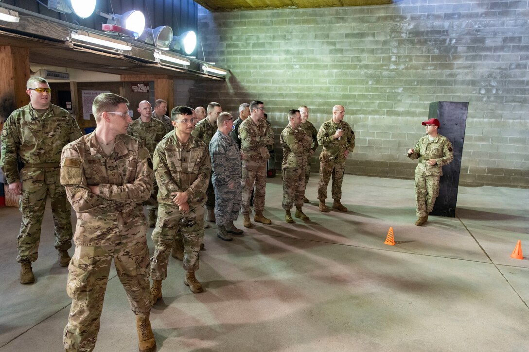 U.S. Air Force Tech. Sgt. Micah Wilson, the 97th Security Forces Squadron Combat Arms non-commissioned officer in charge, explains safety guidelines to a group of Airman participating in a sheepdog shootout event, May 15, 2019, at the Altus Air Force Base Firing Range, Okla. Participants were reminded about general gun safety and precautions before the event in order to keep Airmen safe. (U.S. Air Force photo by Airman 1st Class Breanna Klemm)