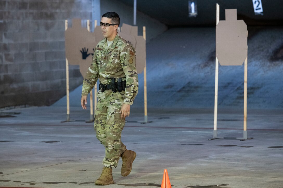 U.S. Air Force Maj. Nathaniel Lesher, Commander of the 97th Security Forces Squadron, observes targets after a sheepdog shootout hosted by the 97th SFS, May 15, 2019, at the Altus Air Force base Firing Range, Okla. At the end of each round, scores were calculated by three different factors; the amount of ammunition used, the time it took to complete the course and the amount of shots that missed the target. (U.S. Air Force photo by Airman 1st Class Breanna Klemm)