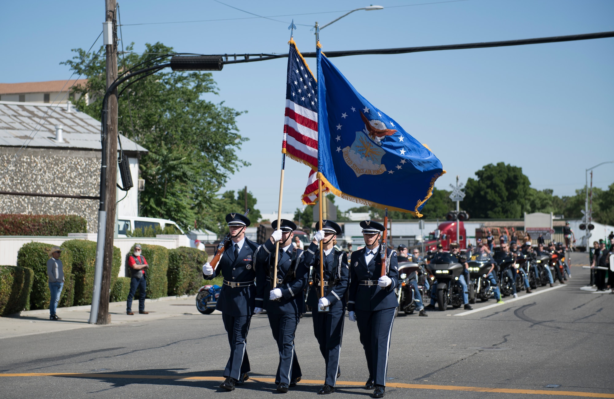 U.S. Air Force Airmen, assigned to the Travis Air Force Base Honor Guard, step off in formation as part of the annual Dixon May Fair Parade in Dixon, California, May 11, 2019. The Honor Guardsmen, along with Airmen from the 60th Operations Group and 60th Air Mobility Wing marched in the parade to promote community engagement and build strong partnerships. (U.S. Air Force photo by Airman 1st Class Amy Younger)