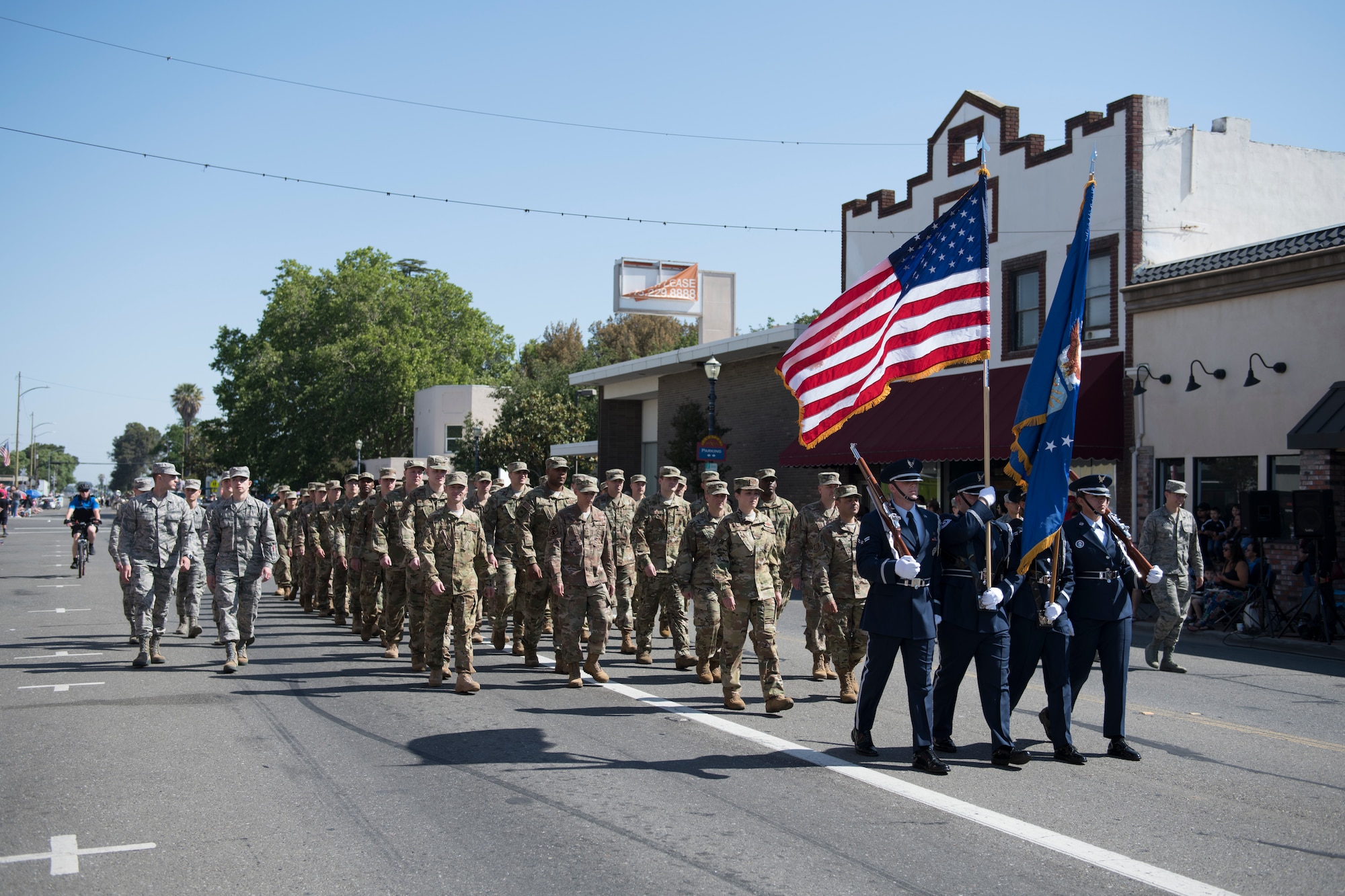 U.S. Air Force Airmen assigned to the 60th Air Mobility Wing march in the annual Dixon May Fair Parade in Dixon, California, May 11, 2019. The Airmen from the 60th Operations Group and the Wing Staff Agency marched in the parade to promote community engagement and build strong partnerships. (U.S. Air Force photo by Airman 1st Class Amy Younger)