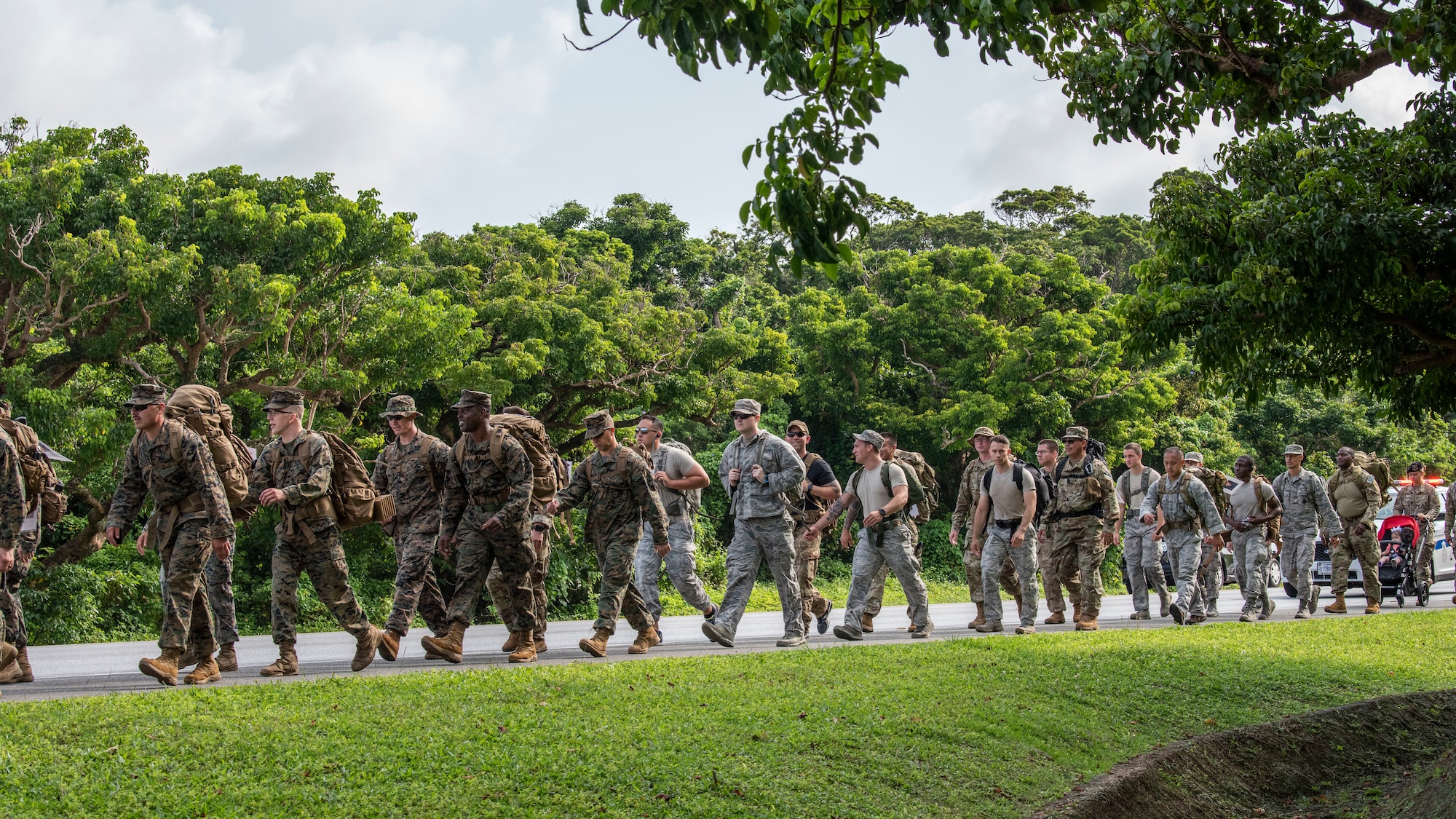 U.S. Air Force Airmen and U.S. Marines participate in the Fallen/Suicide Law Enforcement Officer Ruck March at Kadena Air Base, Japan, for police week, May 15, 2019.