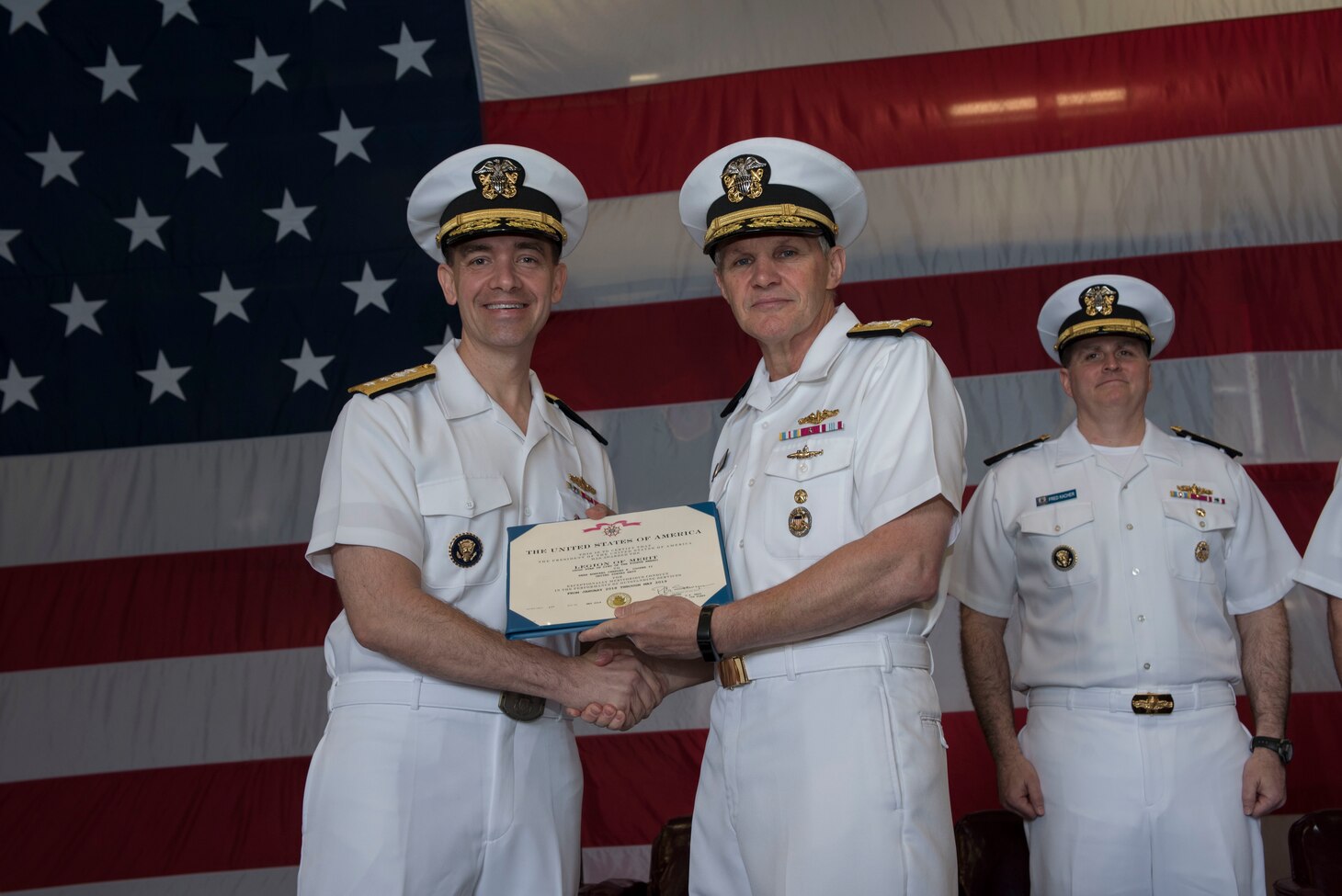SASEBO, Japan (May 17, 2019) Vice Adm. Phillip Sawyer, right, commander, U.S. 7th Fleet, awards Rear Adm. Brad Cooper, commander, Amphibious Force 7th Fleet, the Legion of Merit, aboard the amphibious assault ship USS Wasp (LHD 1) during Cooper’s change of command ceremony held aboard the flagship.  Commander, Amphibious Force 7th Fleet is the Navy’s only forward-deployed amphibious force, headquartered at White Beach Naval Facility in Okinawa, Japan, and is responsible for the full range of expeditionary operations from disaster relief to crisis response in the U.S. 7th Fleet area of operations.