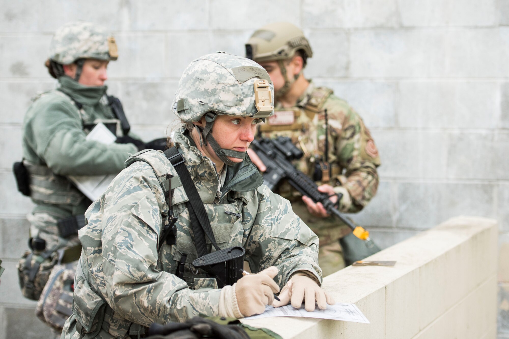Airman 1st Class Kayla Sine, assigned to the 167th Security Forces Squadron, makes notes during a training exercise at Alpena Combat Readiness Training Center, Alpena, Mich., May 7, 2019. Approximately 300 167th AW Airmen participated in the training event. (U.S. Air National Guard photo by Tech. Sgt. Jodie Witmer)