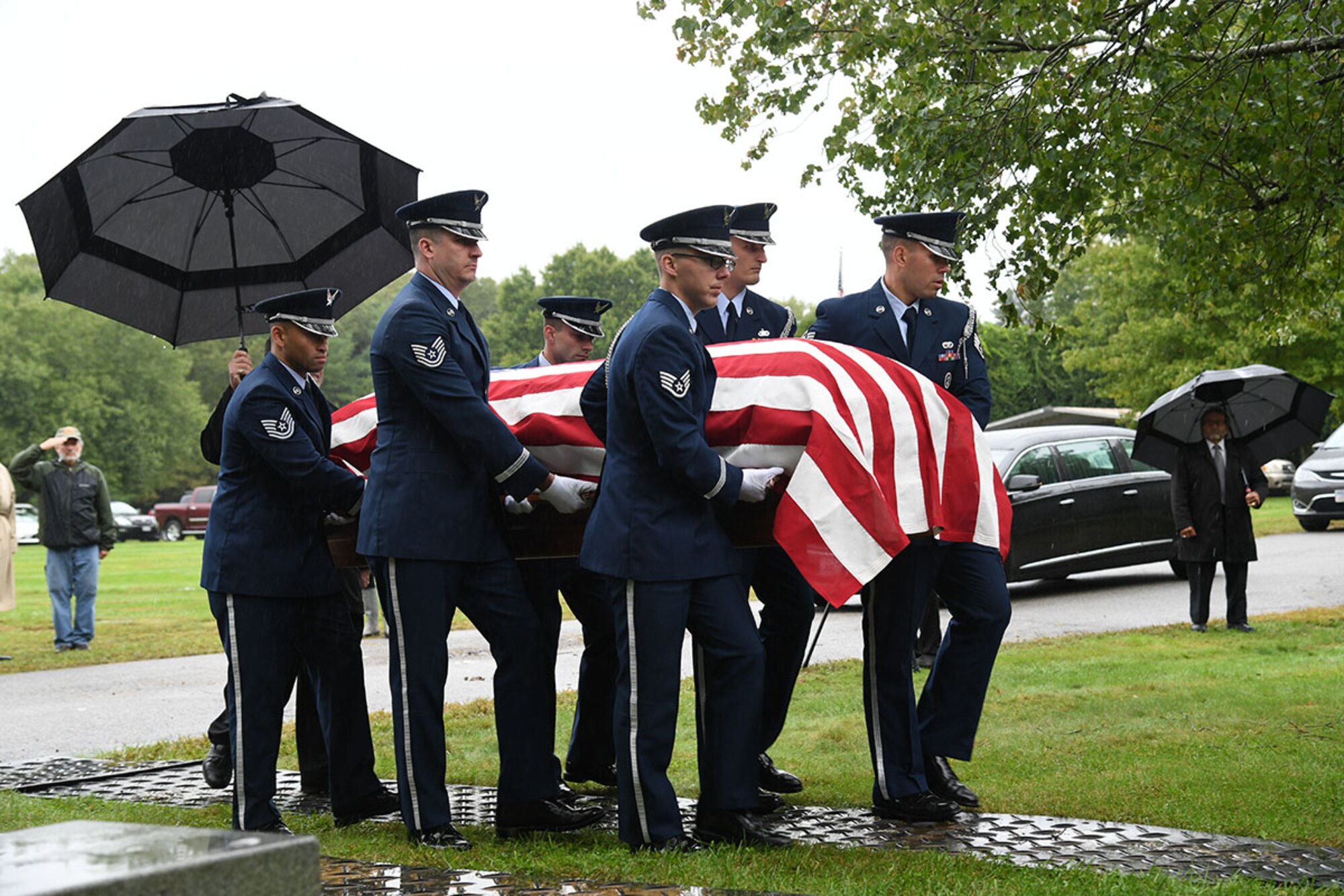 Members of the Hanscom Air Force Base, Mass. Patriot Honor Guard carry the remains of U.S. Air Force Col. Fredric M. Mellor as he is laid to rest at Rhode Island Veterans Memorial Cemetery Sept. 28.