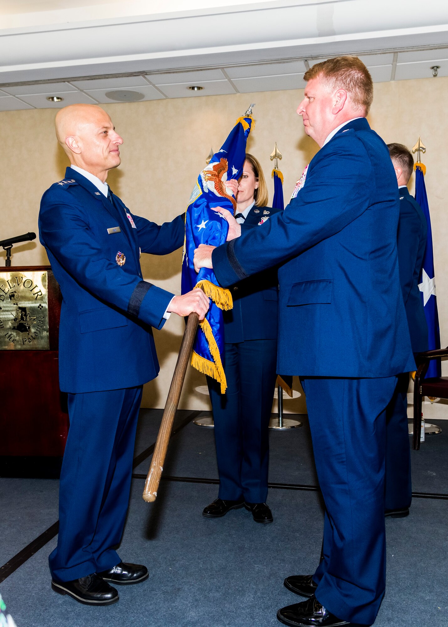 Brig. Gen. Terry L Bullard accepts the Air Force Office of Special Investigations flag from Lt. Gen. Sami D. Said, The Inspector General of the Air Force, during AFOSI's Change of Command Ceremony, May 16, 2019. General Bullard is the 19th Commander in the 70-year history of AFOSI. (U.S. Air Force photo by Mr. Michael Hastings)