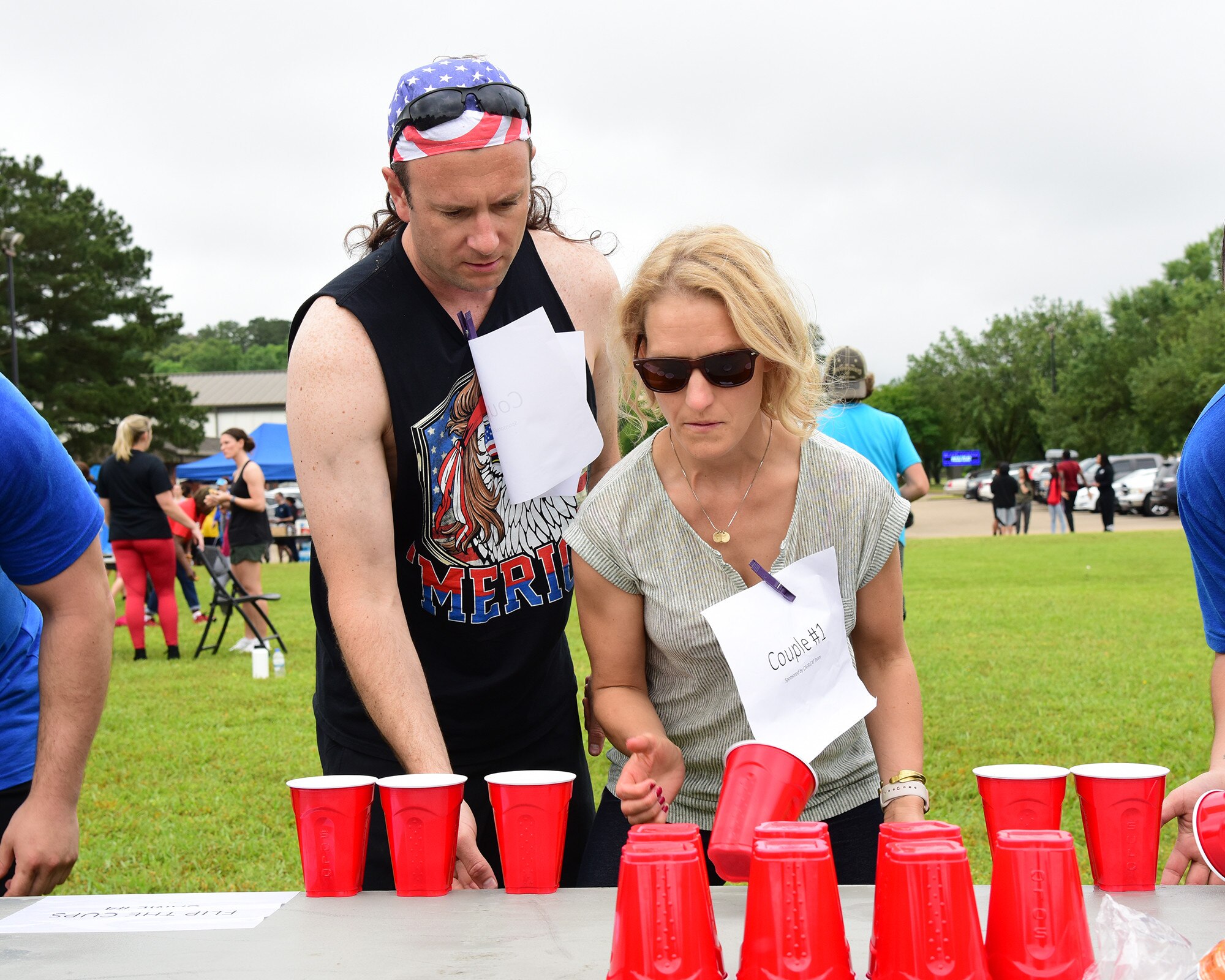 Military spouses participate in various challenges during the Military Spouse Appreciation Day barbeque May 10, 2019, on Columbus Air Force Base, Miss. Similar to the challenges in the international game show, Minute to Win It, spouse groups raced against each other in a competition to see who could complete the challenges in the shortest amount of time (U.S. Air Force photo by Melissa Doublin)