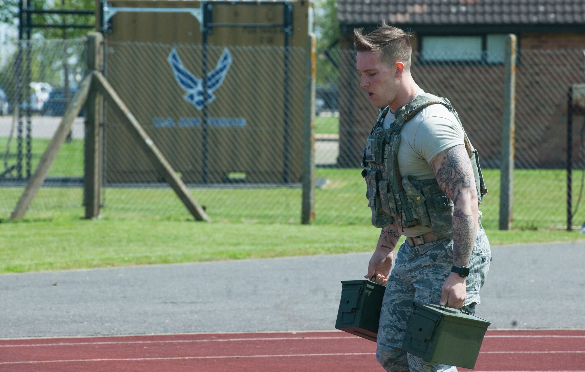U.S. Air Force Airman 1st Class Justin McFarland, a defender with the 423rd Security Forces Squadron, carries ammo cans during a Police Week Defenders Challenge at RAF Alconbury, England on May 15, 2019. Police Week occurs each year across the peace officer community as a way of remembrance of those that have served in law enforcement and those that paid have the ultimate sacrifice. (U.S. Air Force photo by MSgt. Brian Kimball)
