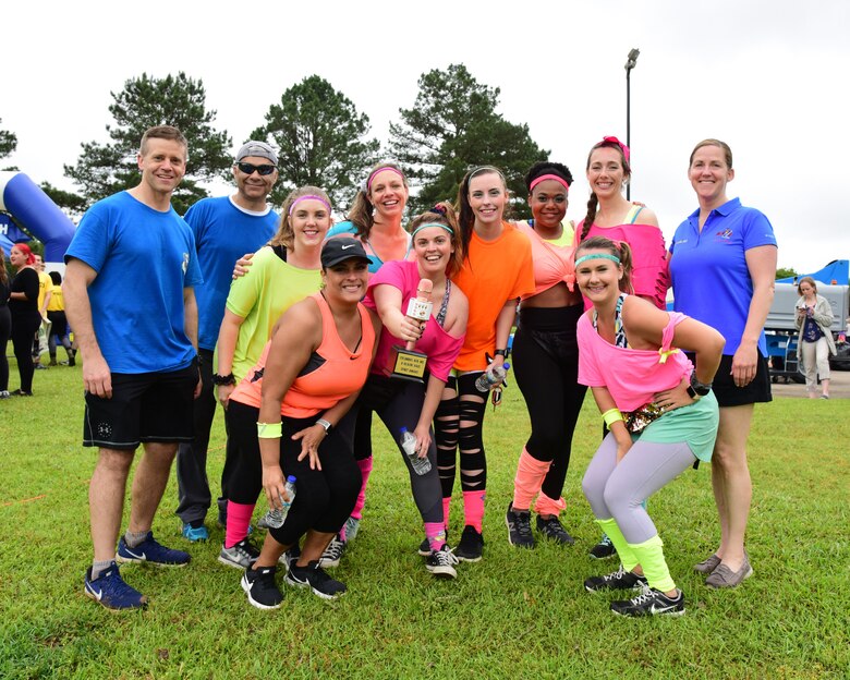 Leadership from the 14th Flying Training Wing stand with the spirit award winners, the Ladies of the 80s, during the A-BLAZIN’ Race May 10, 2019, on Columbus Air Force Base, Miss. Nearly 230 Team BLAZE members signed up to participate in the A-BLAZIN’ Race. The Ladies of the 80s won the award for their outfits, spunk and overall singing capabilities at the karaoke battle. (U.S. Air Force photo by Melissa Doublin)