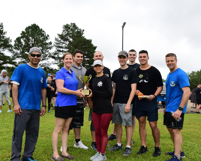 Leadership from the 14th Flying Training Wing stand with the first place winners of the A-BLAZIN’ Race May 10, 2019, on Columbus Air Force Base, Miss. Nearly 230 Team BLAZE members signed up to participate in the A-BLAZIN’ Race. (U.S. Air Force photo by Melissa Doublin)