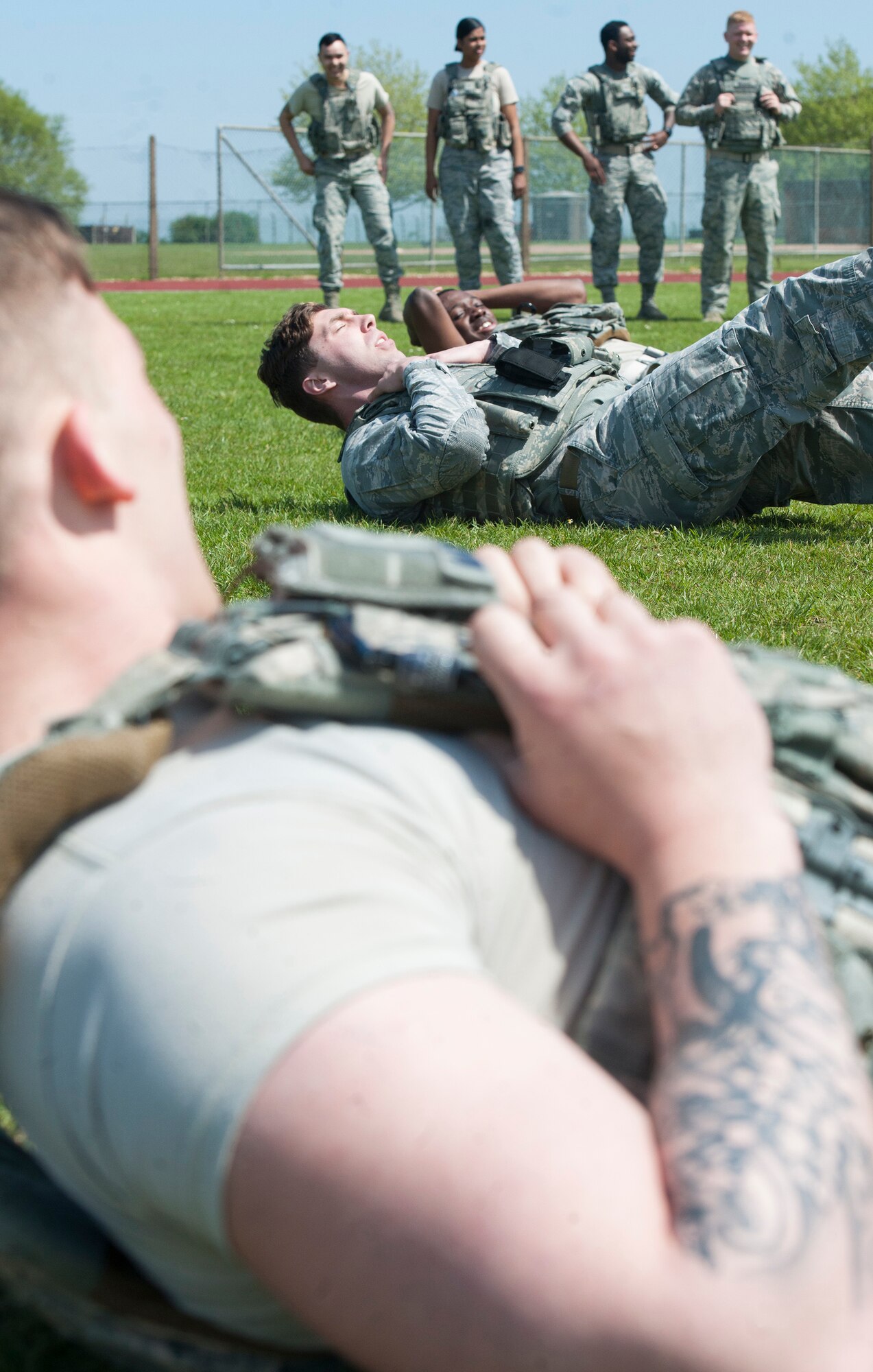 U.S. Air Force Defenders with the 423rd Security Forces Squadron, complete a round of sit-ups during a Police Week Defenders Challenge at RAF Alconbury, England on May 15, 2019. Police Week occurs each year across the peace officer community as a way of remembrance of those that have served in law enforcement and those that paid have the ultimate sacrifice. (U.S. Air Force photo by MSgt. Brian Kimball