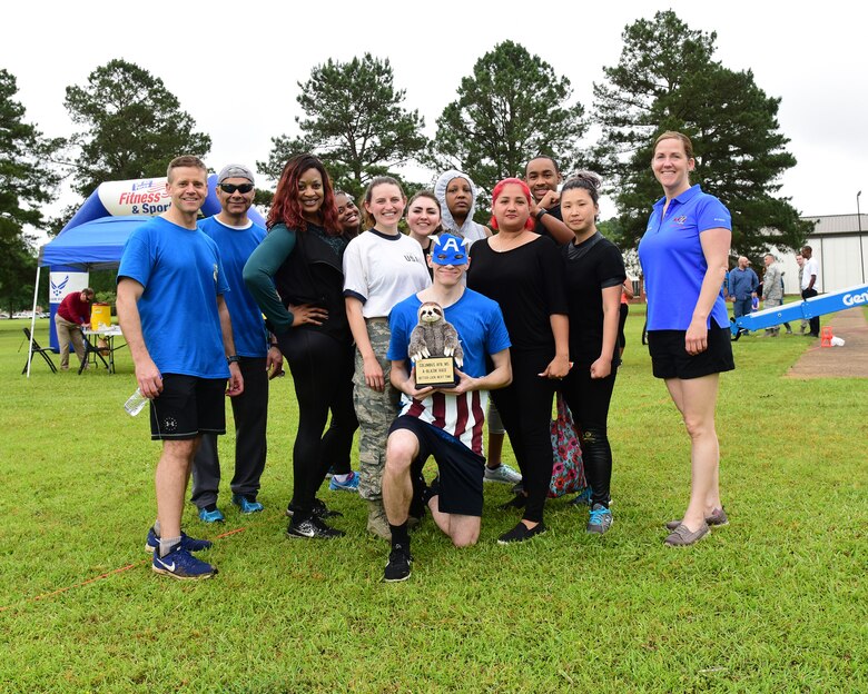 Leadership from the 14th Flying Training Wing stand with the winners of the sloth award, the Force Support Squadron Avengers, during the A-BLAZIN’ Race May 10, 2019, on Columbus Air Force Base, Miss. Nearly 230 Team BLAZE members signed up to participate in the A-BLAZIN’ Race. The FSS Avengers were awarded the sloth award for arriving in last place during the event. (U.S. Air Force photo by Melissa Doublin)