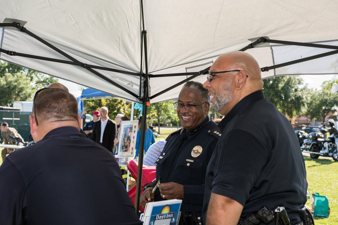 Montgomery Police Department officers talk amongst one another during the Maxwell Police Week Jamboree at Freedom Park.