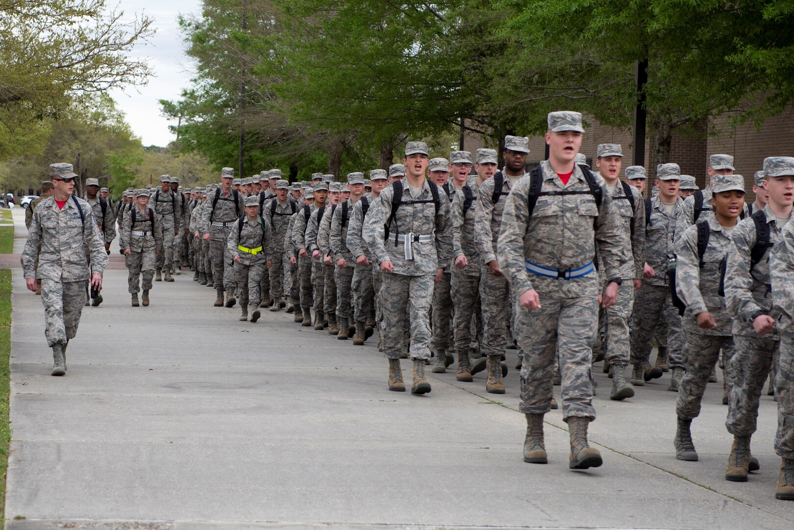 Tech. Sgt. Joshua Free, 336th Training Squadron military training leader, marches 336th TRS students to their dorms at Keesler Air Force Base, Mississippi, March 15, 2019. An AFIMSC initiative changing the method of payment for technical school student travel is projected to save the Air Force $5 million annually.