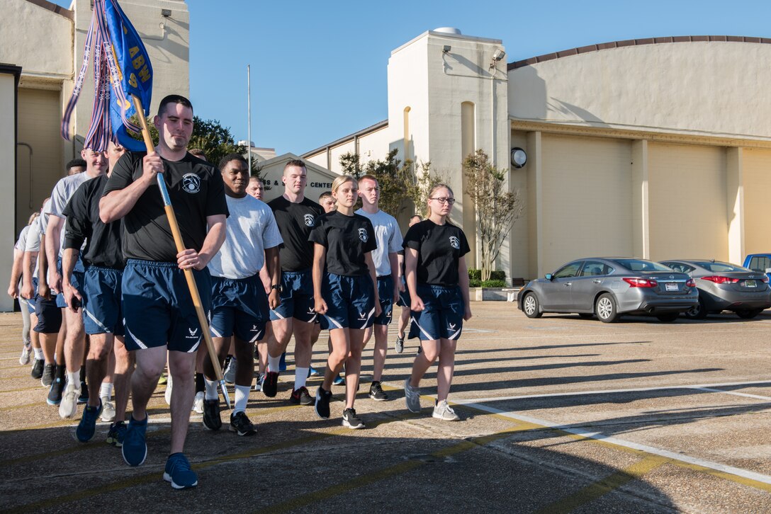 42nd Security Forces Squadron Airmen march in formation outside of the base gym.