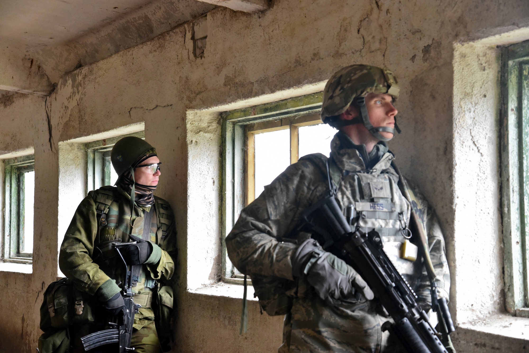Airman 1st Class David Hess, 175th Security Forces Squadron specialist, Maryland Air National Guard (front) stands guard with a member of the Estonian Defense Force during the annual Spring Storm exercise, May 7, 2019, in Ida-Viru County, Estonia. The Spring Storm exercise fostered collaboration for over 9,000 military personnel from more than a dozen NATO partner countries.(U.S. Air National Guard photo by Staff Sgt. Enjoli Saunders)