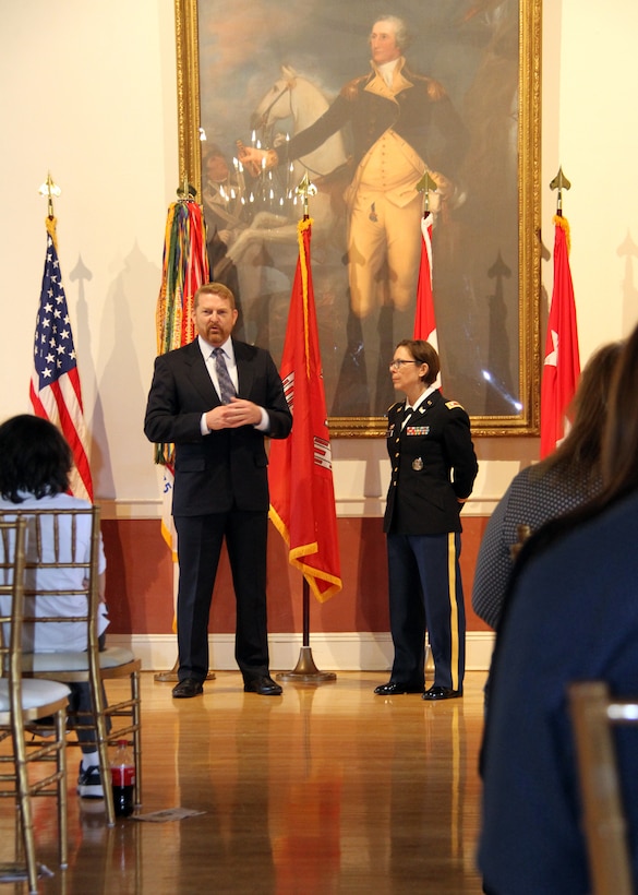 Col. (Retired) Bryan Green (left) made remarks about serving with Lt. Col. Julie D'Annunzio (right) during her retirement ceremony held May 10, at the Fort Hamilton Community Club's Washington Room in Brooklyn, New York.