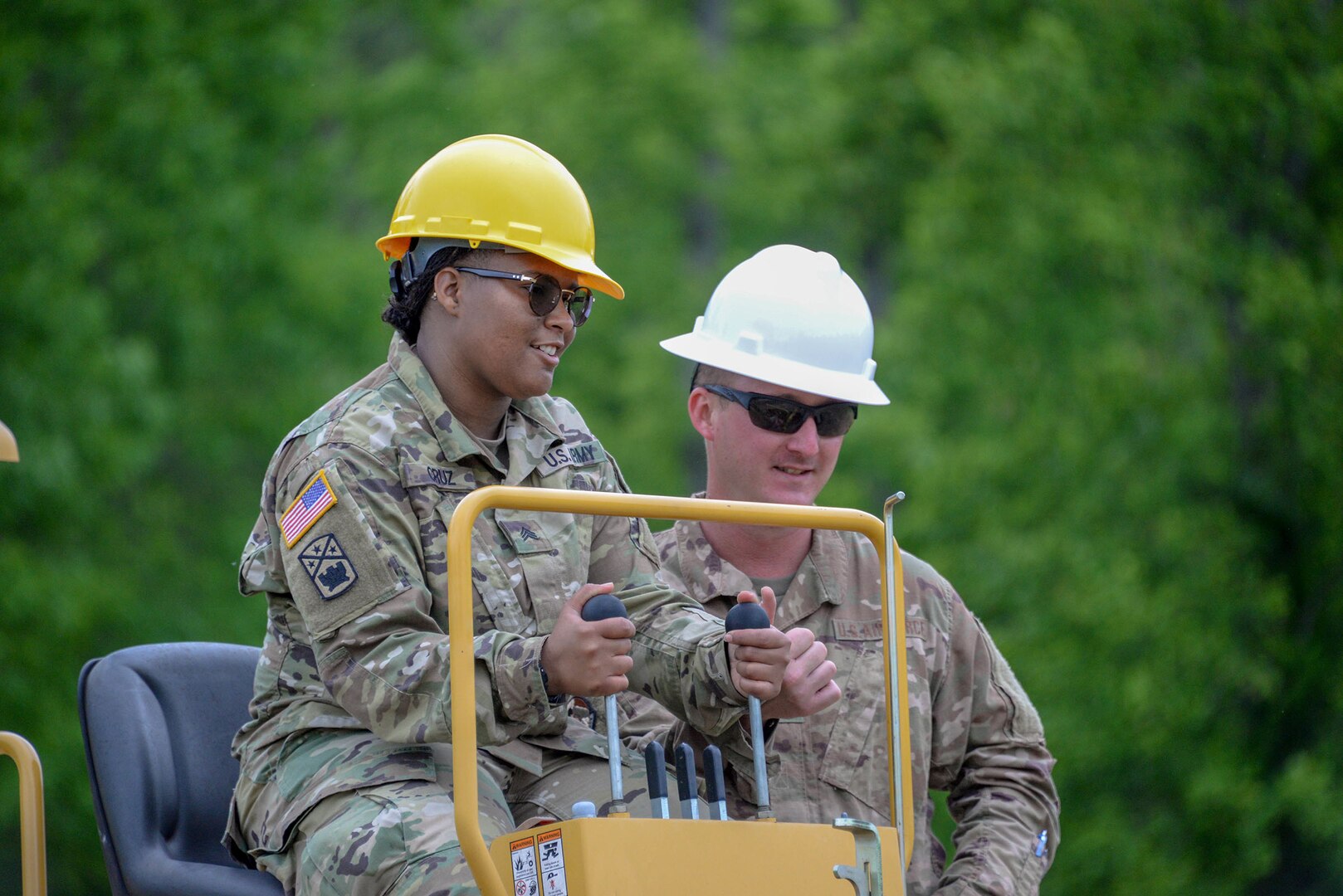 Sgt. Shantophia Cruz listens as Tech. Sgt. Doug Haveman explains operation of the Vermeer RT950.Airmen from the 241st Engineering Installation Squadron and Soldiers from the 230th Signal Company came together in Chatoosa, Georgia, May 9, 2019, to perform joint training. The 241st EIS Airmen provided training on heavy equipment needed to dig trenches for installation of fiber optics and other communications services.