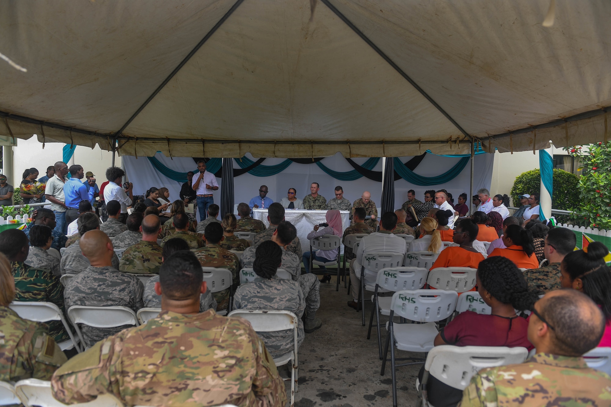 Dr. Devendra Radhy, Port Mourant doctor in charge, speaks during the closing ceremony of the ophthalmology center during New Horizons exercise 2019 at Port Mourant, Guyana, May 16, 2019. The ophthalmology clinic was established to provide aid to the Guyanese population by screening and selecting patients to receive cataract surgery in support of New Horizons 2019. The New Horizons exercise 2019 provides U.S. military members an opportunity to train for an overseas deployment and the logistical requirements it entails. The exercise promotes bilateral cooperation by providing opportunities for U.S. and partner nation military engineers, medical personnel and support staff to work and train side by side.(U.S. Air Force photo by Senior Airman Derek Seifert)