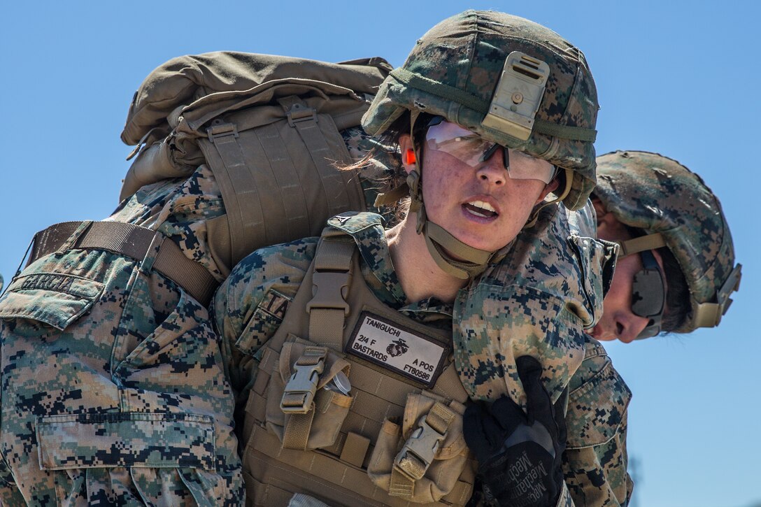U.S. Marine Corps Lance Cpl. Autumn Taniguchi, a rifleman with Company F, 2nd Battalion, 4th Marine Regiment, 1st Marine Division, fireman carries Cpl. Antonio Garcia, a fire support Marine with 2nd Battalion, 11th Marine Regiment, during an Urban Leaders Course (ULC) at Marine Corps Base Camp Pendleton, California, April 24, 2019.