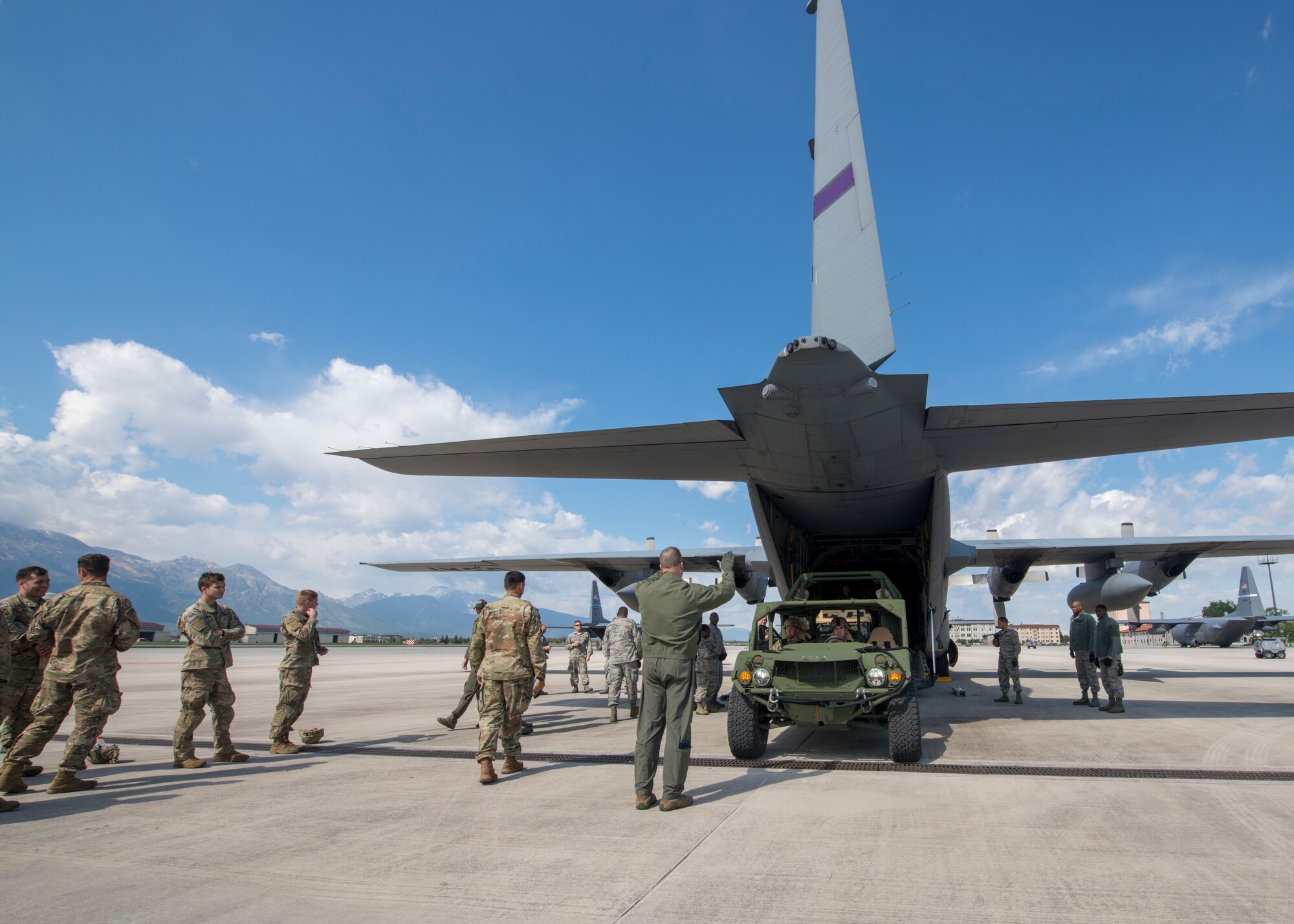 A U.S. Army ground mobility vehicle backs into a C-130H Hercules, operated by the 96th Airlift Squadron, 934th Airlift Wing, Minneapolis–St. Paul Joint Air Reserve Station, Minnesota, during Immediate Response 2019 May 14, 2019, at Aviano Air Base, Italy. Exercise Immediate Response 2019 is a multinational exercise, co-led by the Croatian Armed Forces, Slovenian Armed Forces and U.S. Army Europe. The combined training provides opportunities to improve interoperability among participating allies and regional partners. (U.S. Air Force photo by Staff Sgt. Zachary Cacicia)