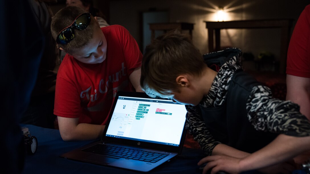 Two fourth grade students from Tri-County North practice their programing skills using software applications during the Air Force Research Laboratory’s 7th annual Full Throttle STEM at Eldora Speedway May 14. (U.S. Air Force photo/Richard Eldridge)