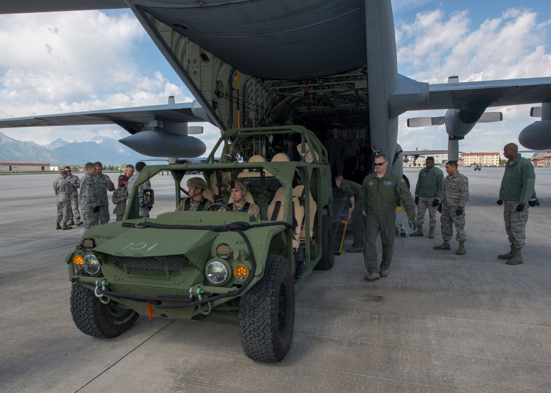 A U.S. Army ground mobility vehicle backs into a C-130H Hercules, operated by the 96th Airlift Squadron, 934th Airlift Wing, Minneapolis–St. Paul Joint Air Reserve Station, Minnesota, during Immediate Response 2019 May 14, 2019, at Aviano Air Base, Italy. There are approximately 3,000 U.S. Army Europe personnel participating in the exercise from various Army units and more than 6,000 from 15 allied and partner nations. The combined training provides opportunities to improve interoperability among participating allies and regional partners. (U.S. Air Force photo by Staff Sgt. Zachary Cacicia)