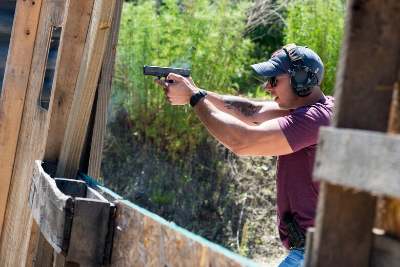 Staff Sgt. Ethan Martin, 23d Security Forces reports and analysis clerk, shoots at a target during a shooting competition, May 14, 2019, in Valdosta, Ga. The competition was a part of Moody’s support of National Police Week 2019, to pay tribute to all law enforcement officers who serve and protect the united States with courage and dedication. (U.S. Air Force photo by Senior Airman Erick Requadt)