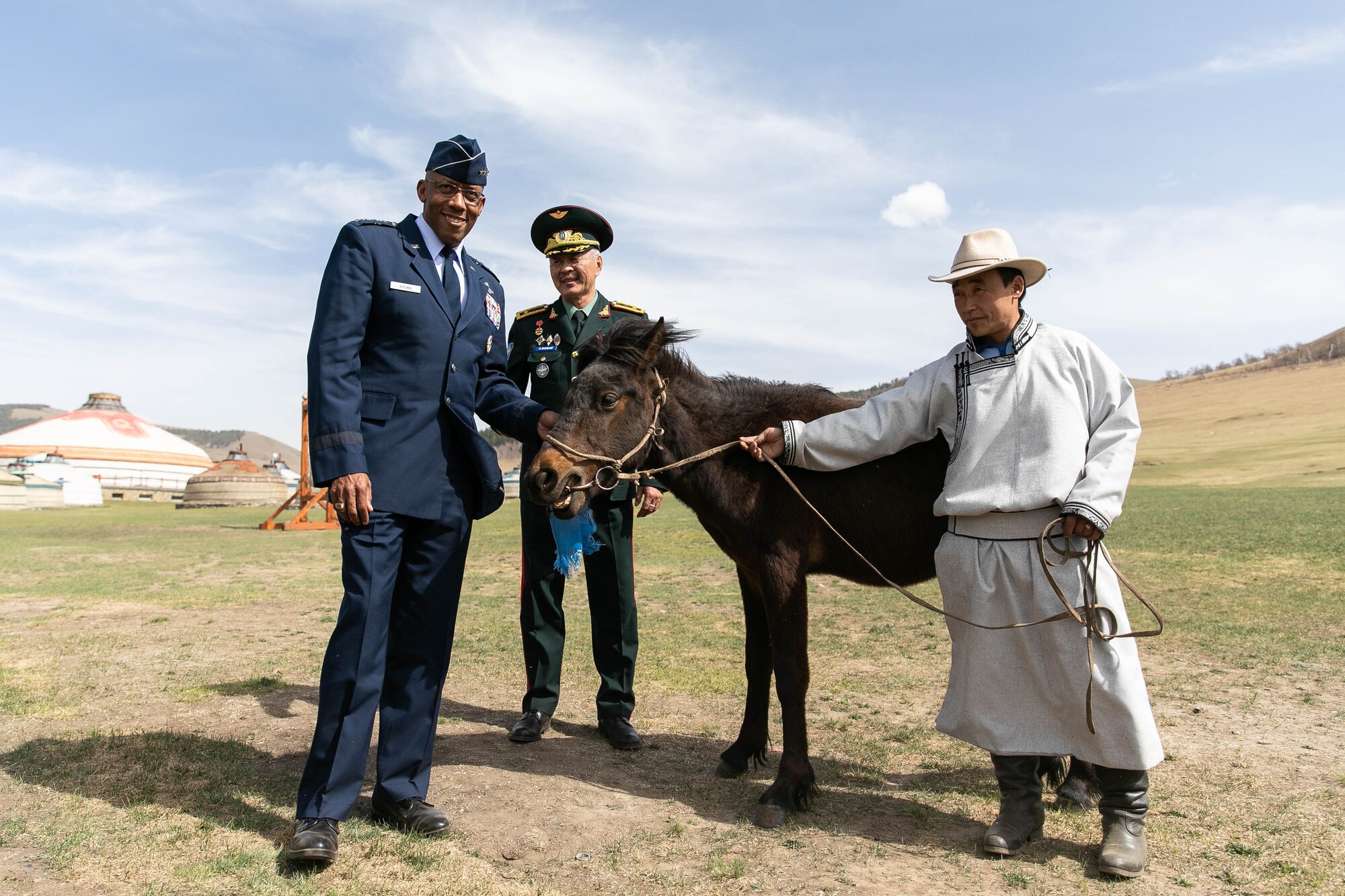 Gen. CQ Brown, Jr., Pacific Air Forces commander, received the traditional gift of a horse from the Mongolian Air Force Command during a visit to the Chingisiin Huree camp south of Mongolia's capital, Ulaanbaatar, May 14. Brown had the honor of naming the horse, to remain in country to exemplify the enduring relationship between the two nations and two air forces. In tribute to his home state of Texas and the state from which he now serves, Hawaii, the general named the young horse, “Lone Star Koa.” Koa is Hawaiian for warrior. (photo courtesy US Embassy)