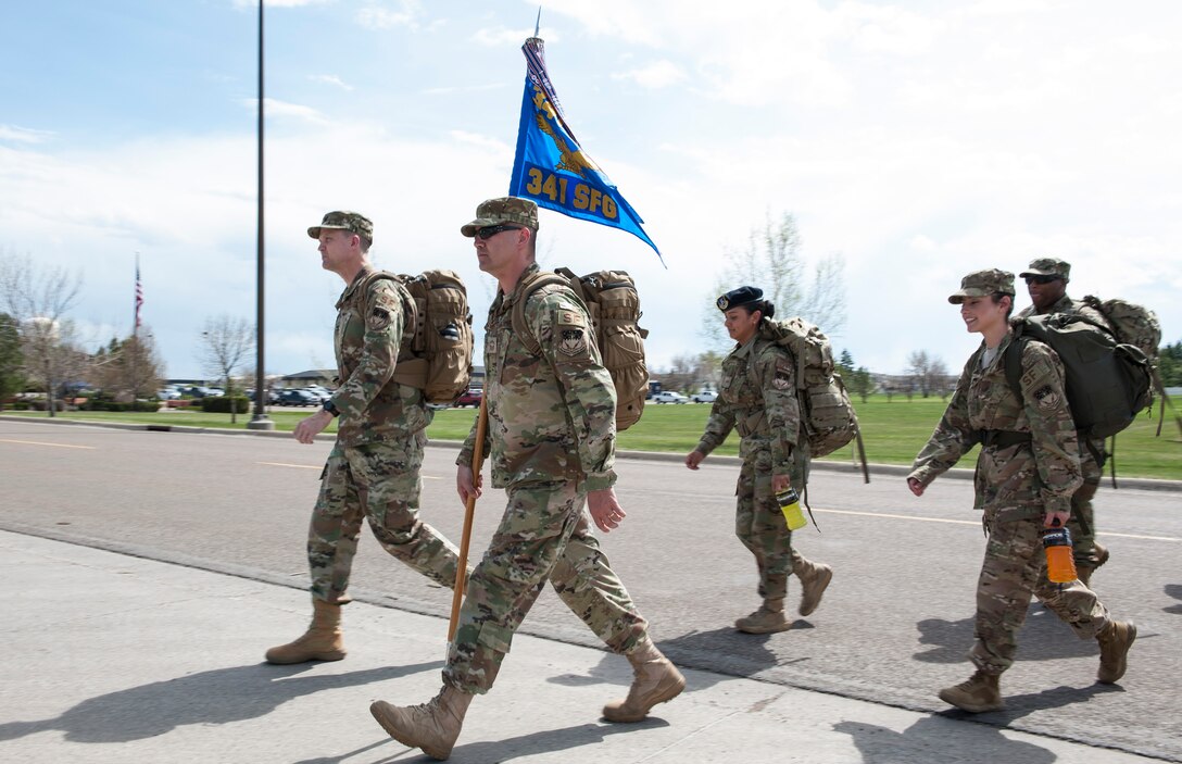 Col. Aaron Guill, 341st Security Forces Group commander, and Chief Master Sgt. Wesley McMackin 341st SFG superintendent, lead members of the 341st SFG on a 5K memorial road march May 14, 2019, at Malmstrom Air Force Base, Mont