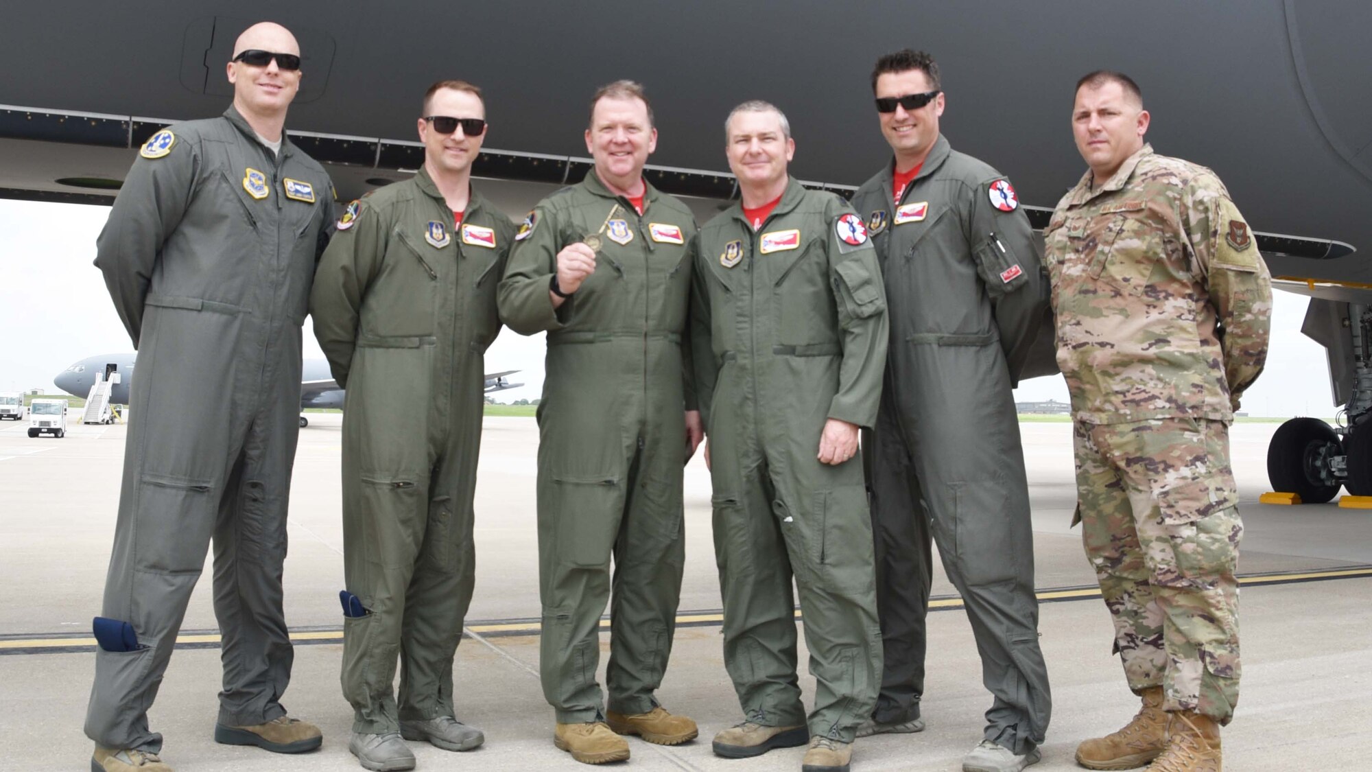 Members of a Team McConnell aircrew pose with Lt. Gen. Richard Scobee, Chief of the Air Force Reserve and Air Force Reserve Command commander, in front of a newly delivered KC-46A Pegasus May 17, 2019, at McConnell Air Force Base, Kan. Scobee was presented with a ceremonial key as part of the event. This is the sixth KC-46 to be delivered to McConnell.