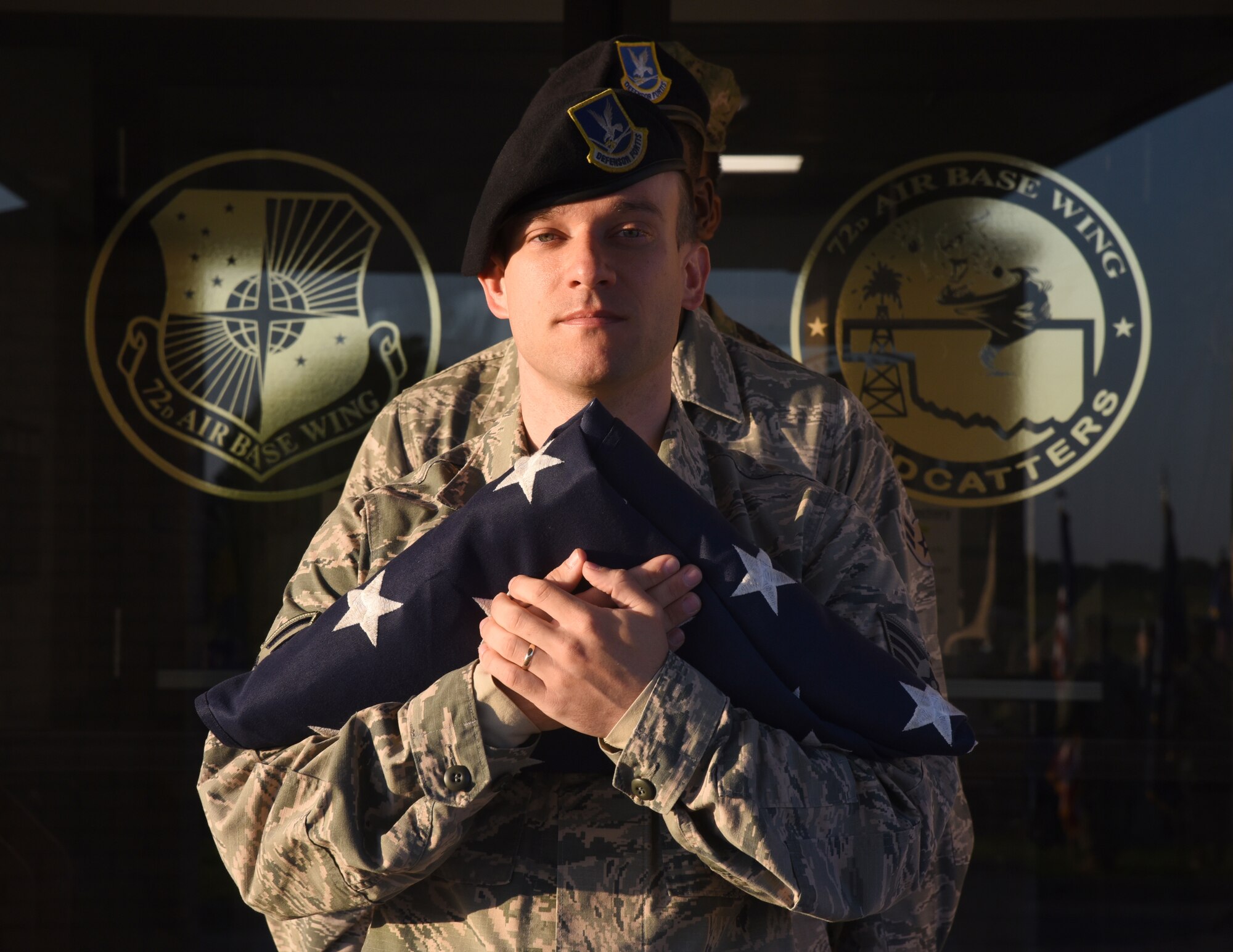 Staff Sgt. Joseph Westphal led the flag detail during Reveille in front of the 72nd Air Base Wing Headquarters building May 13. This week marks National Police Week, honoring the nation’s and military’s defenders and K-9 units who defend the country and those who have died in service.