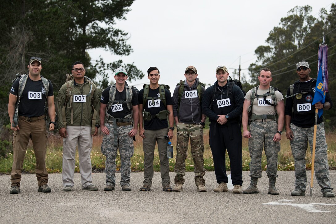 Participants pose for a group photo during the National Police Week ruck to remember May 15, 2019, at Vandenberg Air Force Base, Calif. Ruck competitors carried a 35 lb weighted vest and competed to honor the fallen men and women of law enforcement. (U.S. Air Force photo by Airman 1st Class Hanah Abercrombie)