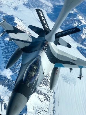 A 465th Air Refueling Squadron aircrew and U.S. Air Force Reserve KC-135 Stratotanker out of Tinker Air Force Base, Oklahoma, refuel an F-16 Fighting Falcon from the 18th Aggressor Squadron at Eielson Air Force Base, Alaska, May 14, 2019, during exercise Northern Edge. Northern Edge provides effective, capabilities-centered joint forces, ready for deployment worldwide and enables real-world proficiency in detection, identification and tracking of units at sea, in the air and on land and respond to multiple crisis in the Indo-Pacific region. (U.S. Air Force photo by Tech Sgt. Bobby Jackson)