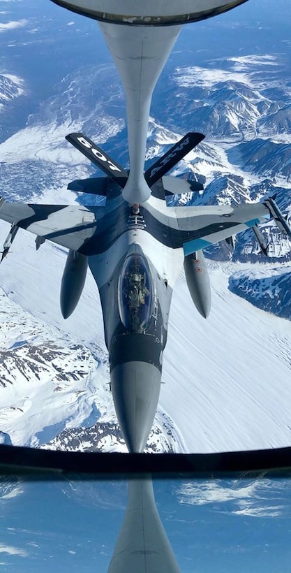 A 465th Air Refueling Squadron aircrew and U.S. Air Force Reserve KC-135 Stratotanker out of Tinker Air Force Base, Oklahoma, refuel an F-16 Fighting Falcon from the 18th Aggressor Squadron at Eielson Air Force Base, Alaska, May 14, 2019, during exercise Northern Edge. Northern Edge provides effective, capabilities-centered joint forces, ready for deployment worldwide and enables real-world proficiency in detection, identification and tracking of units at sea, in the air and on land and respond to multiple crisis in the Indo-Pacific region. (U.S. Air Force photo by Tech Sgt. Bobby Jackson)
