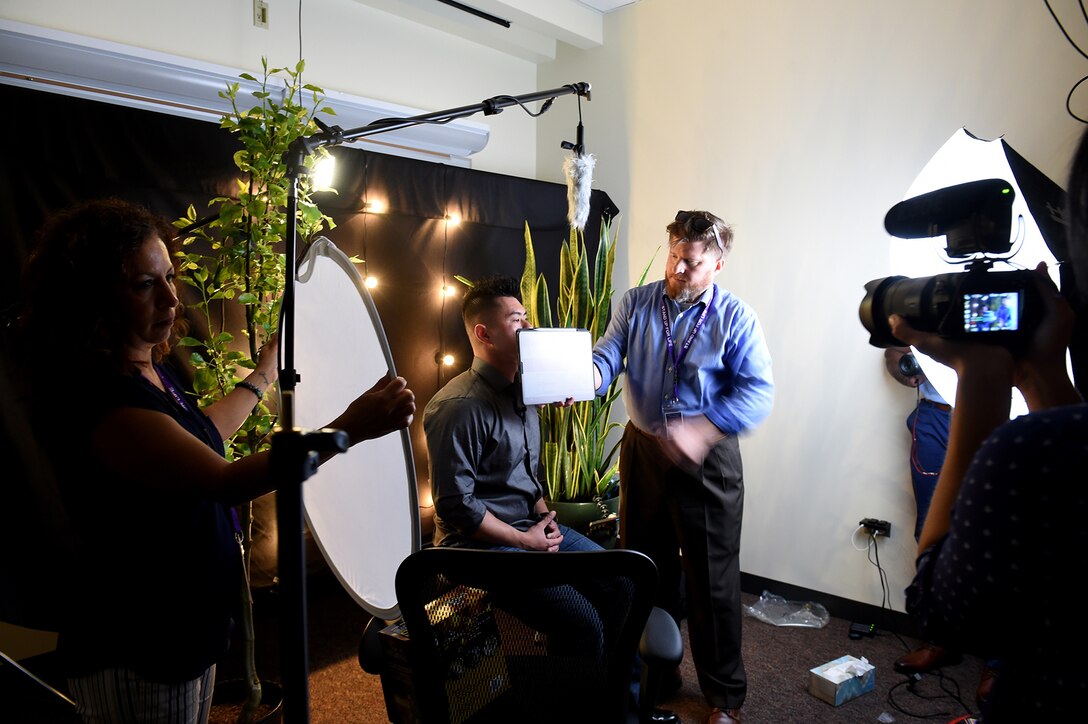 Jason Rogers, right, Suicide Prevention Program Manager, 104th Training Division, prepares a participant for a media interview during the 85th USARC’s ’Stand For Life’ suicide prevention training, May 6-10, 2019, at the 85th USARSC headquarters.