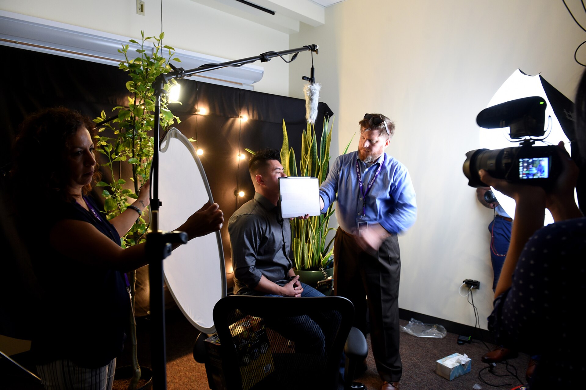 Jason Rogers, right, Suicide Prevention Program Manager, 104th Training Division, prepares a participant for a media interview during the 85th USARC’s ’Stand For Life’ suicide prevention training, May 6-10, 2019, at the 85th USARSC headquarters.