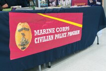 The Provost Marshall Office, Marine Corps Air Ground Combat Center (MCAGCC), took mug shots and created ID kits for children on MCAGCC, Twentynine Palms, Calif., May 16, 2019. The event was held to connect with the community and raise bike safety awareness during police week. (U.S. Marine Corps photo by Lance Cpl. Colton Brownlee)