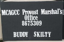 The Provost Marshall Office, Marine Corps Air Ground Combat Center (MCAGCC), took mug shots and created ID kits for children on MCAGCC, Twentynine Palms, Calif., May 16, 2019. The event was held to connect with the community and raise bike safety awareness during police week. (U.S. Marine Corps photo by Lance Cpl. Colton Brownlee)