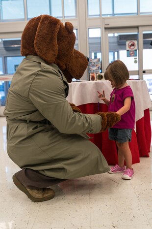 The Provost Marshall Office, Marine Corps Air Ground Combat Center (MCAGCC), took mug shots and created ID kits for children on MCAGCC, Twentynine Palms, Calif., May 16, 2019. The event was held to connect with the community and raise bike safety awareness during police week. (U.S. Marine Corps photo by Lance Cpl. Colton Brownlee)