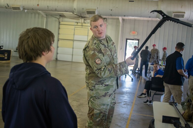 U.S. Air Force Capt. Nathan Bratka, 97th Security Forces Squadron Emergency Services Team (EST) commander, shows off one of the many tools that the EST utilize, May 14, 2019, at Altus, Okla. The EST is used in sensitive first responder calls, when normal tactics are not appropriate for the situation. (U.S. Air Force photo by Senior Airman Cody Dowell)