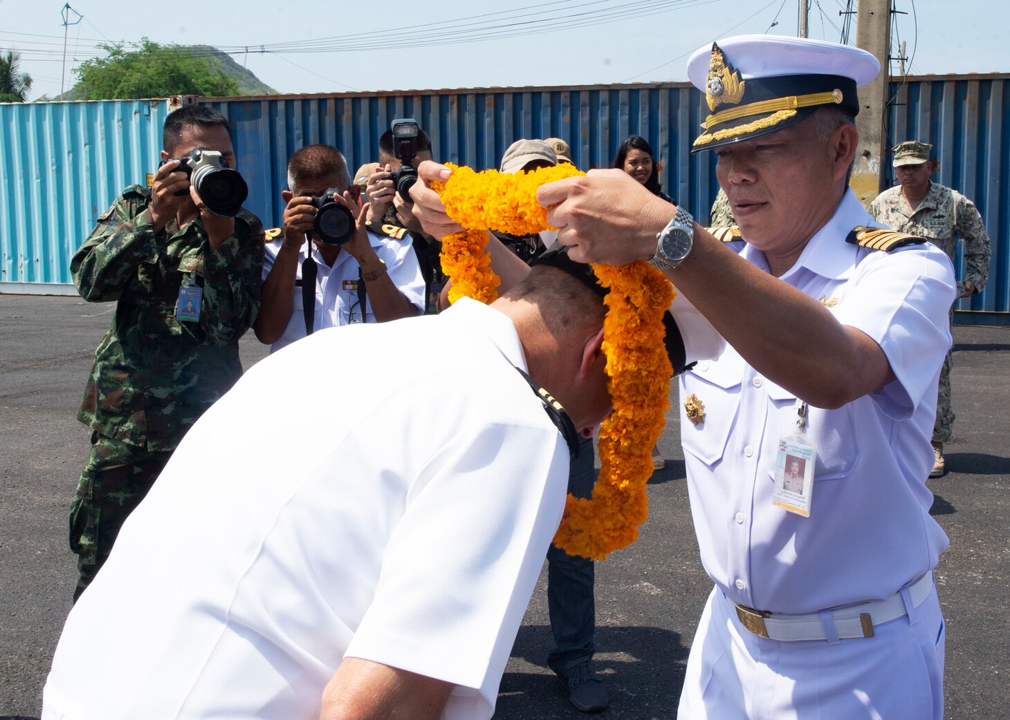 Sattahip, Thailand (May 18, 2019) – Royal Thai Navy Capt. Jakaphan Suwannasawad, chief of Chuk Samed Pier, gifts a lei to U.S. Navy Lt. Cmdr. Nick Lyons, Pacific Partnership 2019 operations officer, following the arrival of fast expeditionary transport ship USNS Fall River (T-EPF 4) in Thailand. Pacific Partnership, now in its 14th iteration, is the largest annual multinational humanitarian assistance and disaster relief preparedness mission conducted in the Indo-Pacific. Each year the mission team works collectively with host and partner nations to enhance regional interoperability and disaster response capabilities, increase security and stability in the region, and foster new and enduring friendships in the Indo-Pacific.